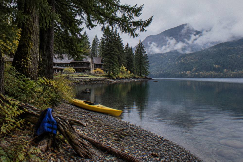 A quiet cove on Lake Crescent with clear water and dense evergreen forest reaching to the shoreline