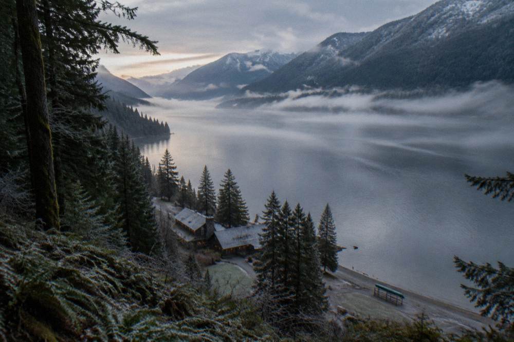 Morning light on Lake Crescent with mist over the water and forested ridges behind
